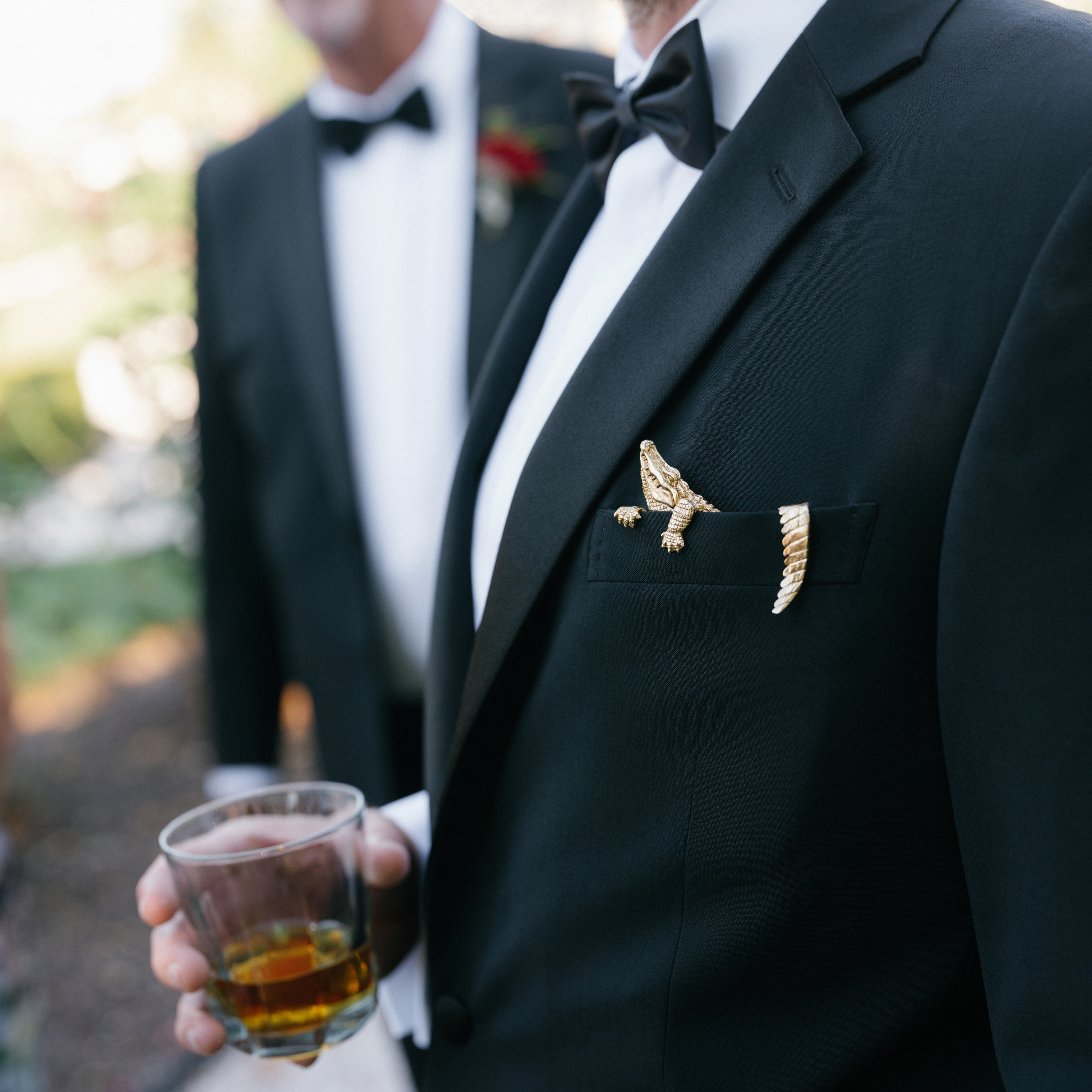 Bronze alligator pocket square styled with black tuxedo formalwear