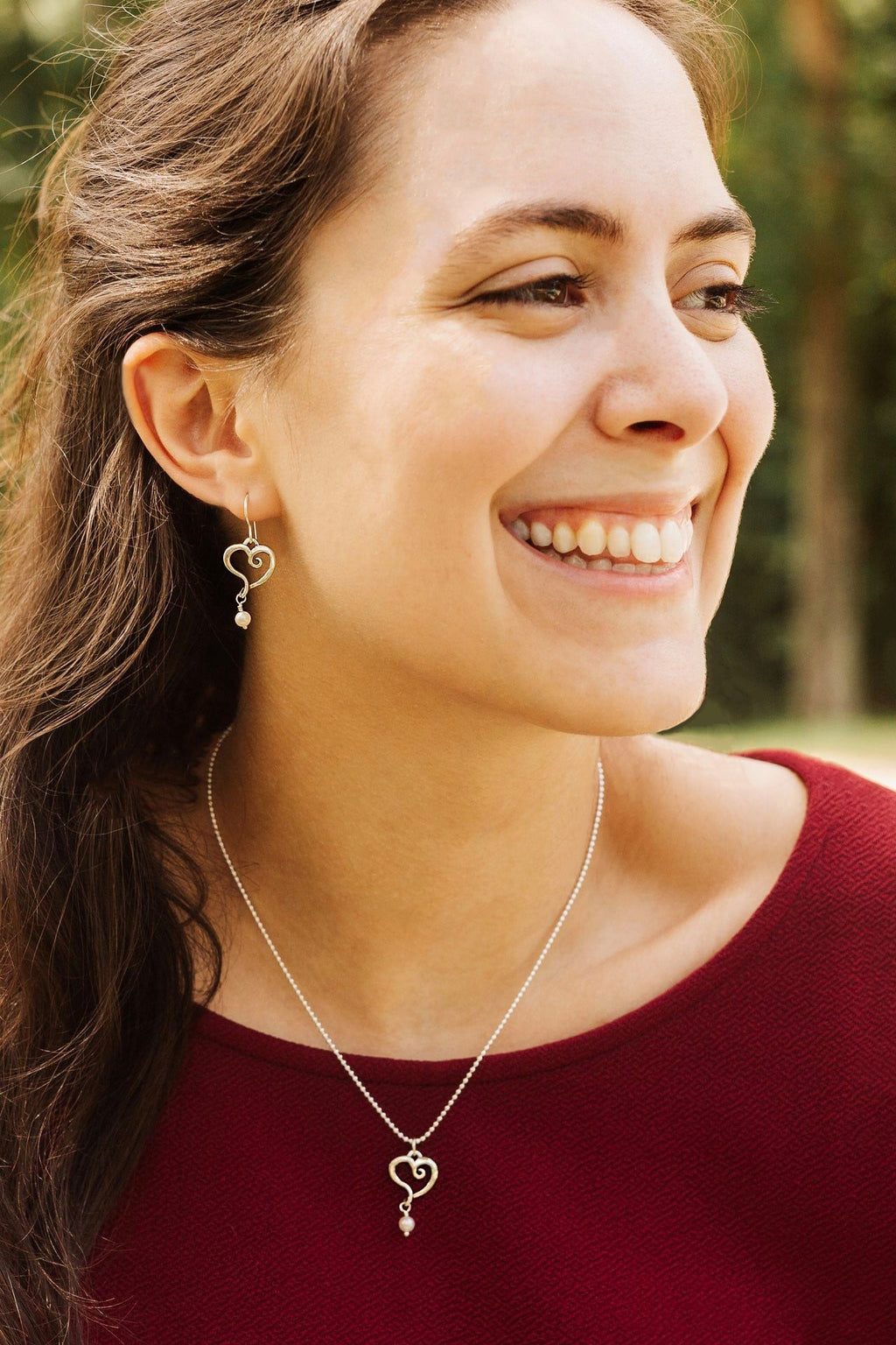 Pearl heart earrings styled for everyday wear