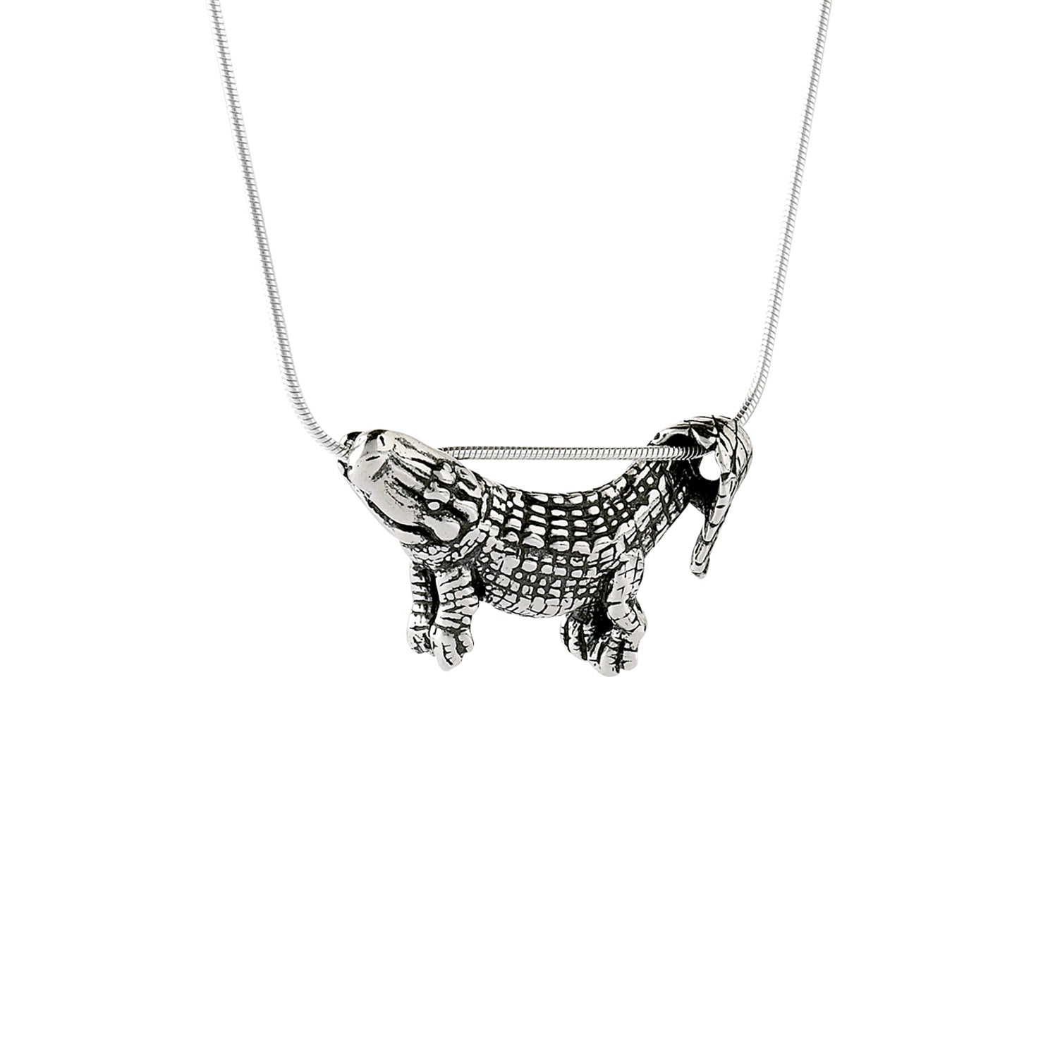 A sterling silver pendant in the shape of an alligator designed to dangle from a chain, with focus on the pendant against a light background.