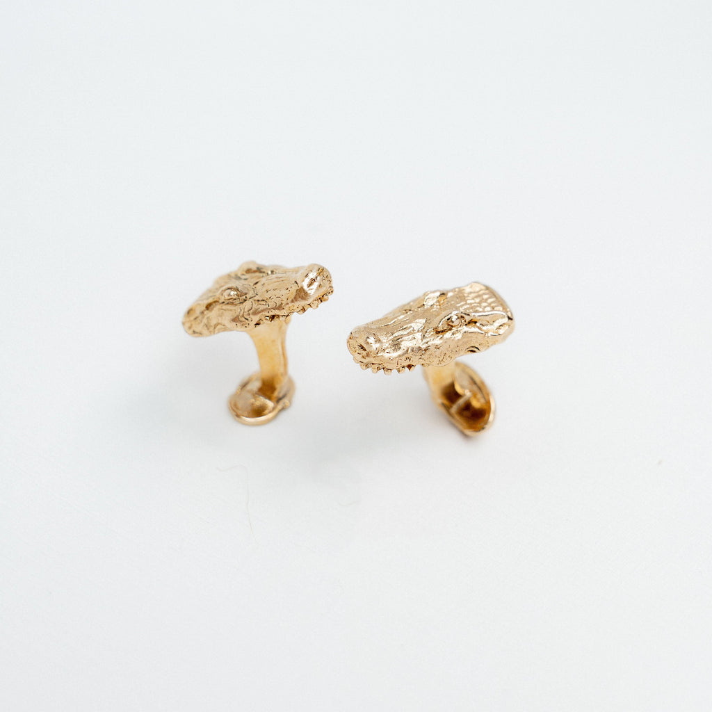 Handcrafted gilded bronze alligator cufflinks inspired by Louisiana bayous.