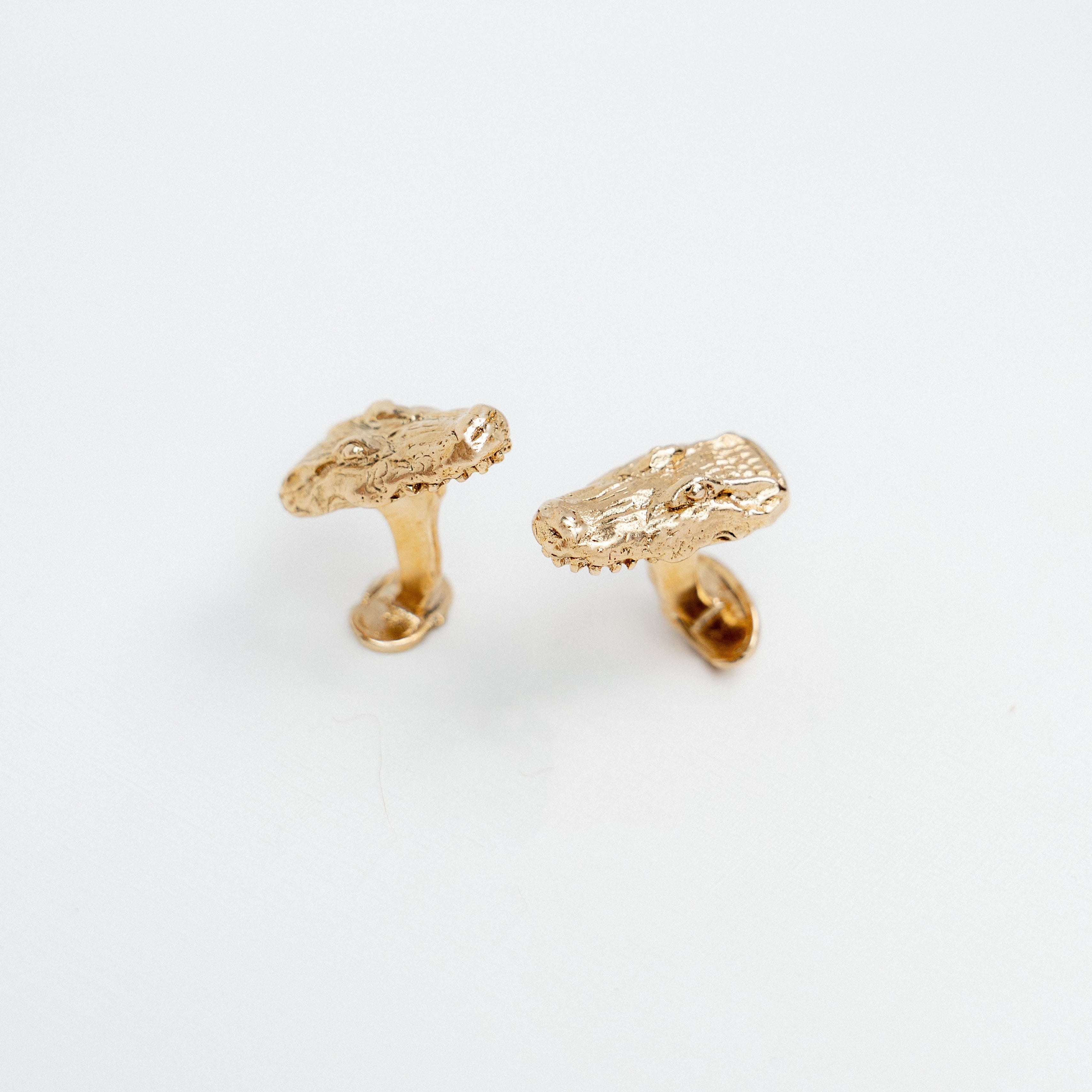 Handcrafted gilded bronze alligator cufflinks inspired by Louisiana bayous.