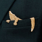 Gilded bronze alligator pocket square worn in suit jacket