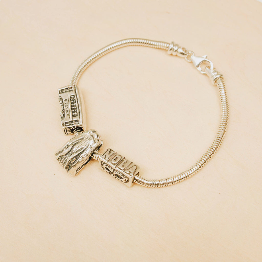 Alligator slide charm worn on a Pandora bracelet, handcrafted in sterling silver inspired by New Orleans