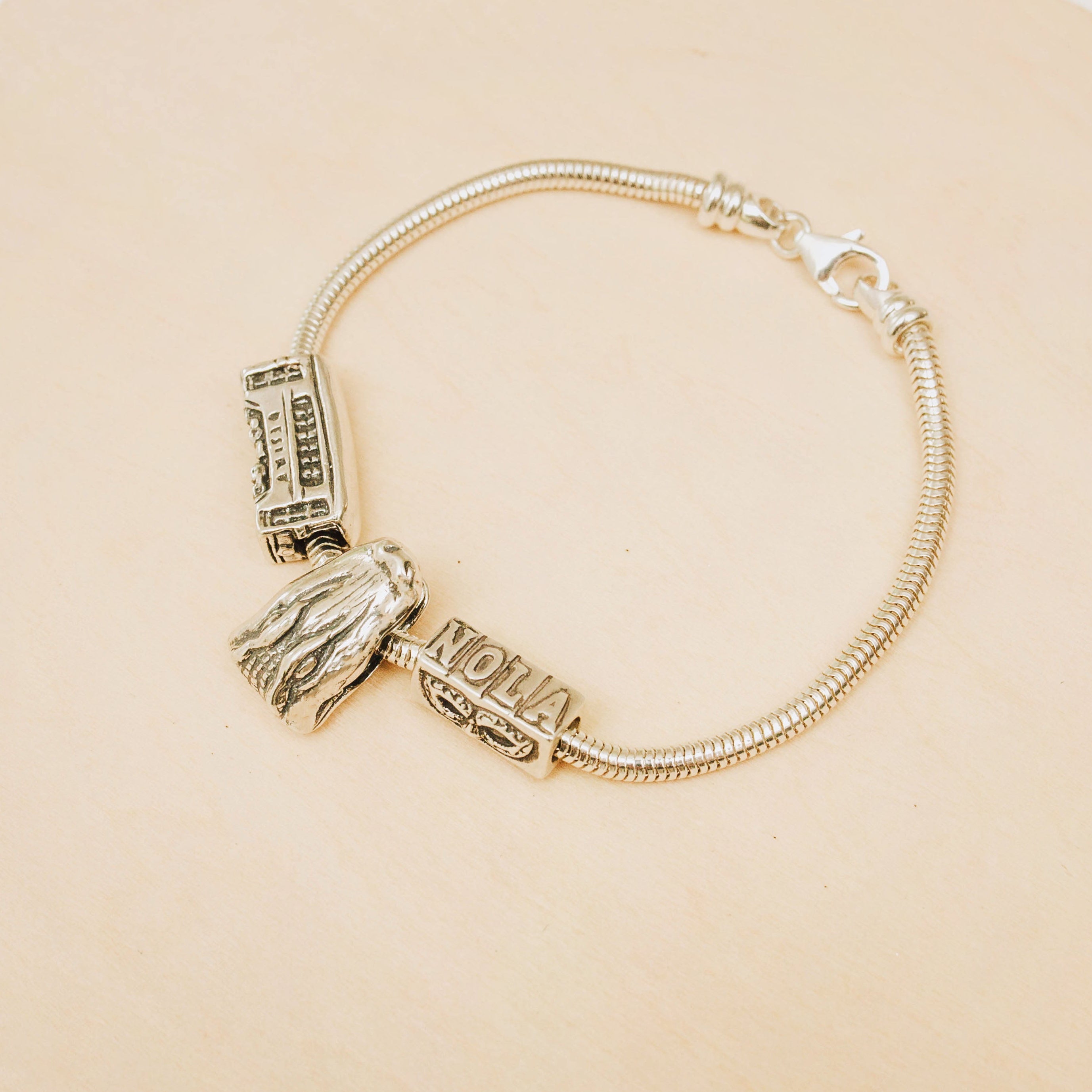 Alligator slide charm worn on a Pandora bracelet, handcrafted in sterling silver inspired by New Orleans