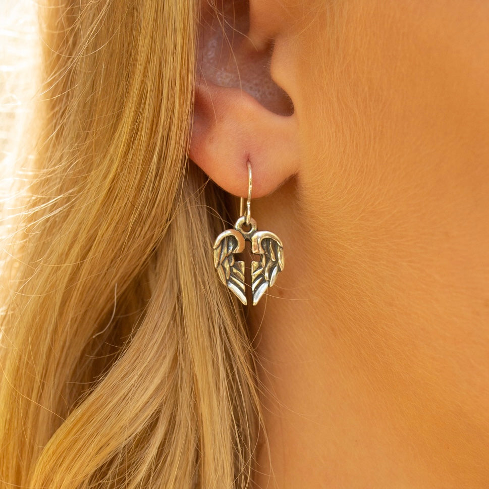 sterling silver angel of hope earrings worn with angel wings forming a cross