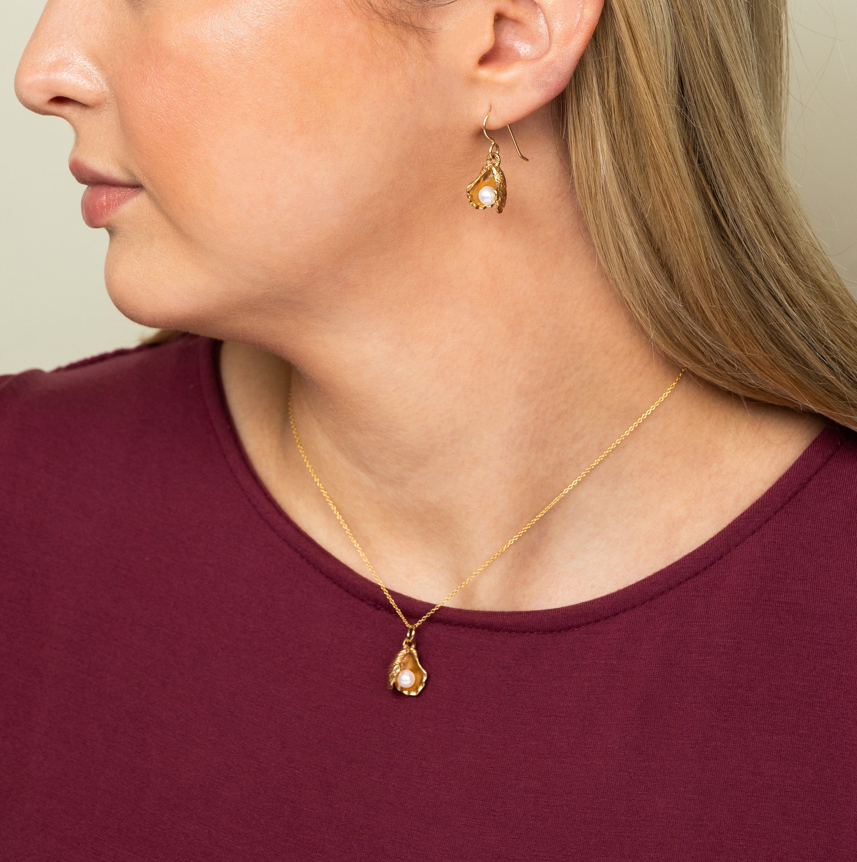 woman wearing bronze oyster pearl earrings — lightweight everyday jewelry