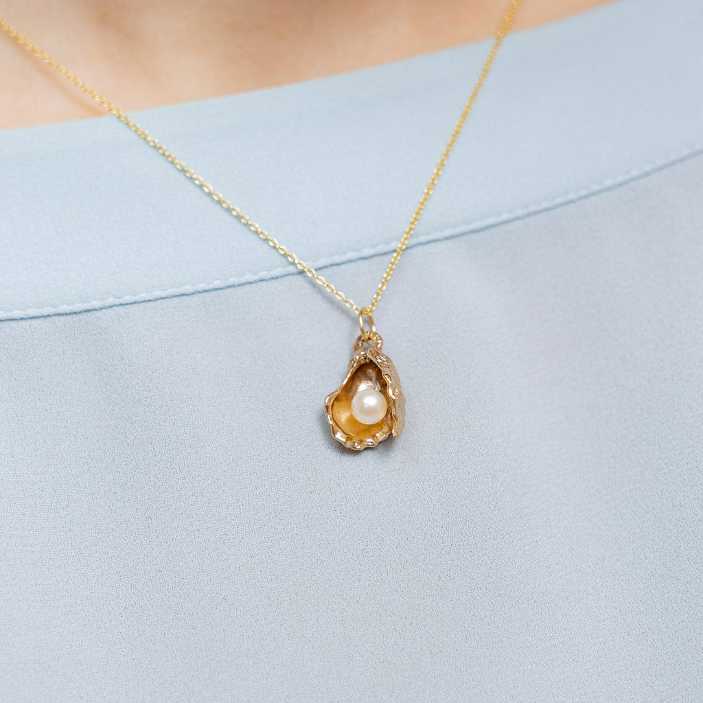 bronze oyster pearl pendant worn on necklace warm tone coastal jewelry