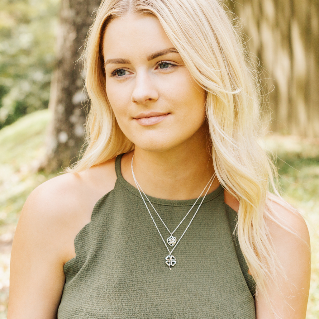 woman wearing sterling silver celtic clover pendant necklace minimalist everyday jewelry look