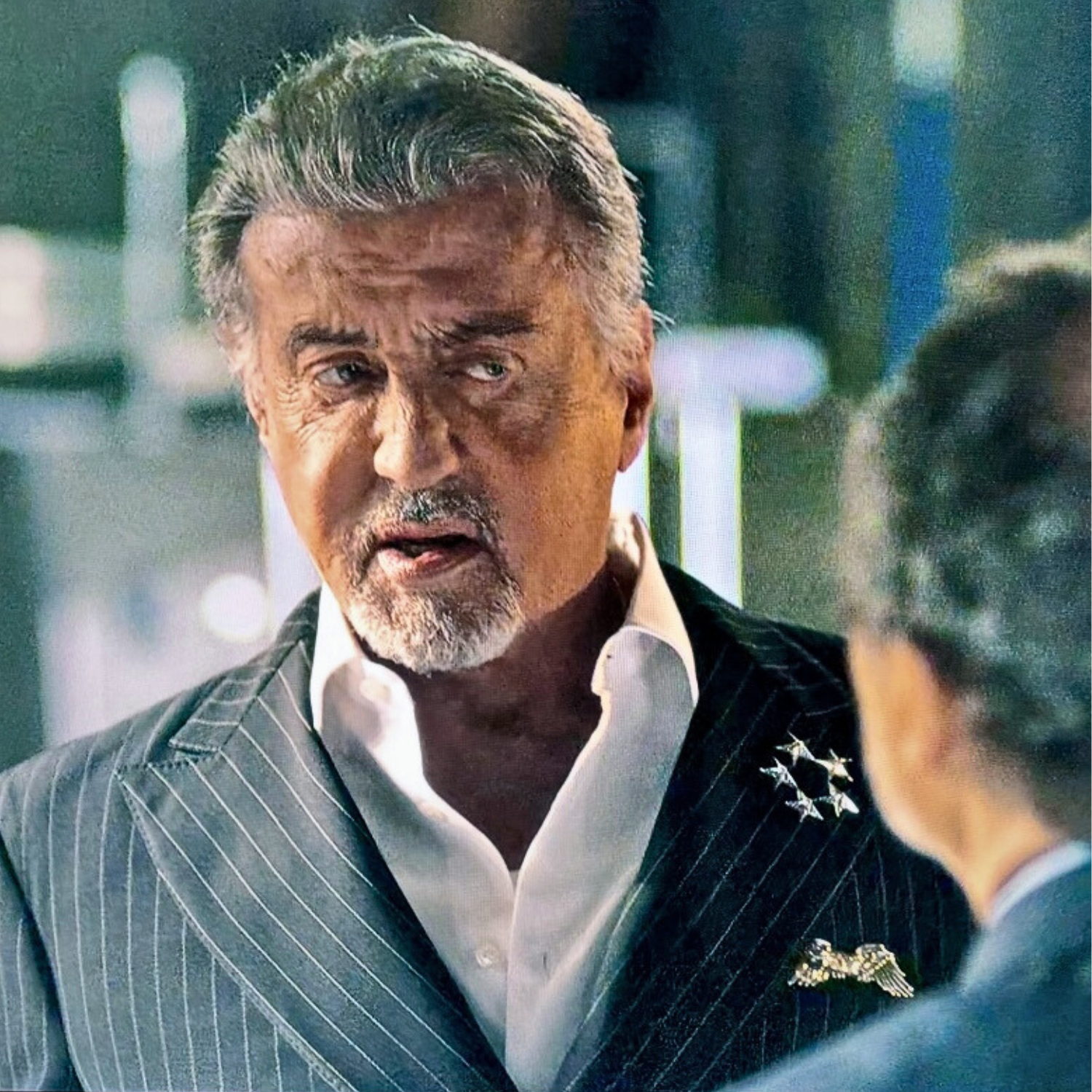Eagle sapphire eye pocket square worn by Sylvester Stallone in Tulsa King, silver eagle design in suit pocket