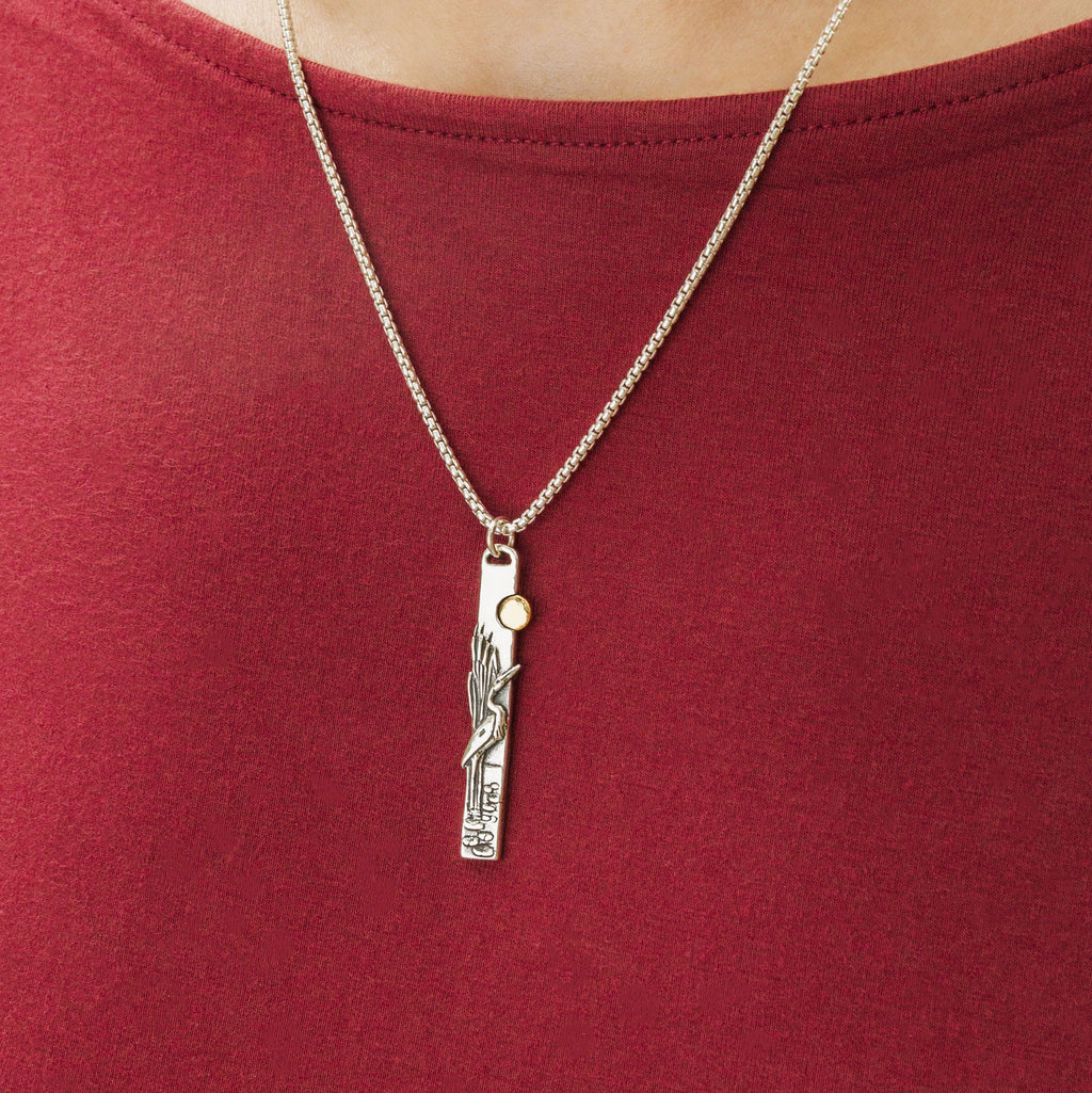 Egret bird pendant necklace worn on model