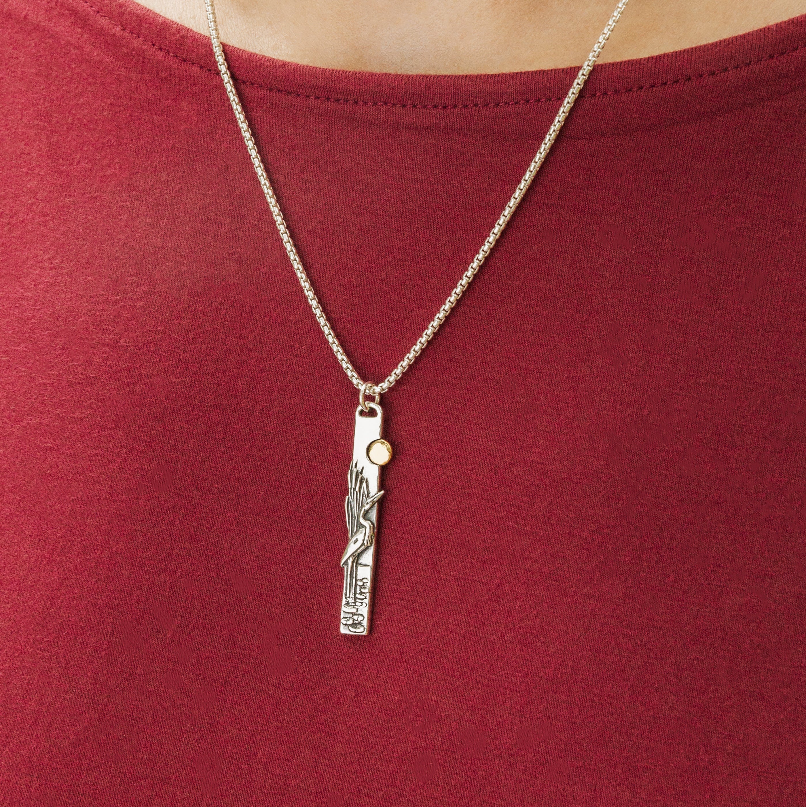 Egret bird pendant necklace worn on model