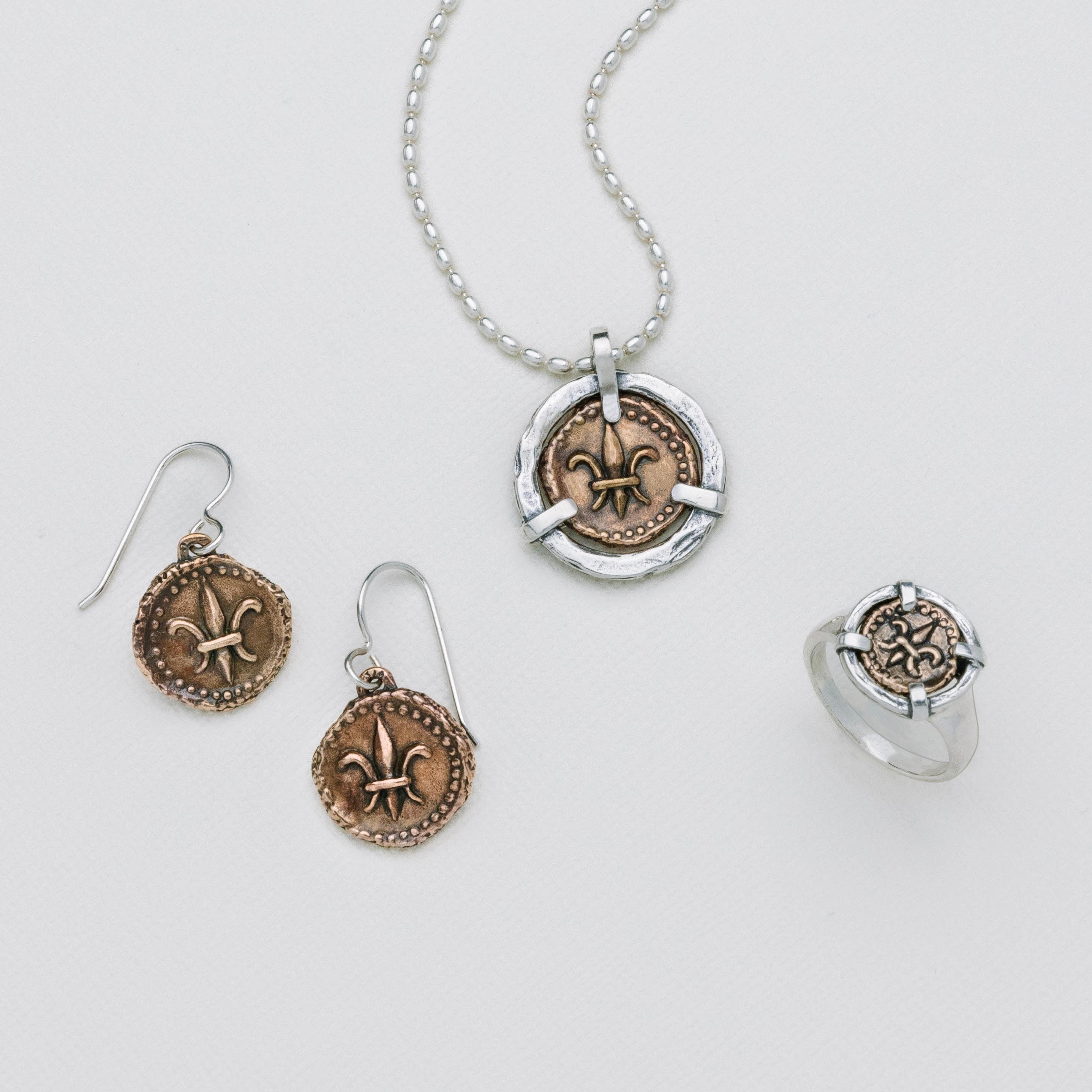 Fleur de lis doubloon pendant with matching earrings and ring