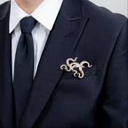 Gilded bronze kraken pocket square worn in formal black suit jacket with tie