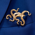 Gilded bronze kraken pocket square worn in blue suit jacket