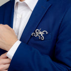 Sterling silver kraken pocket square worn in blue suit jacket 