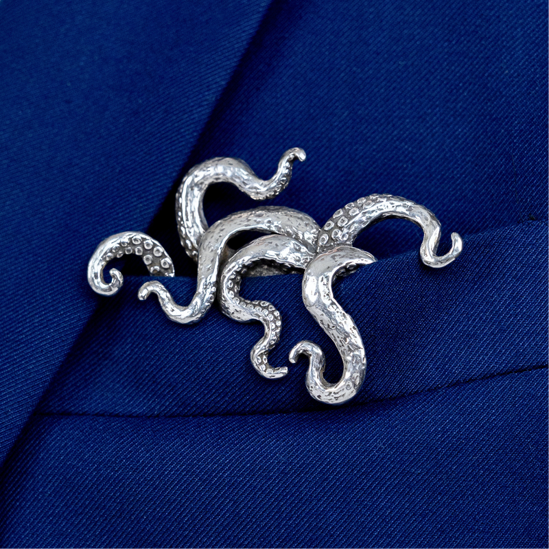 Sterling silver kraken pocket square worn in blue suit jacket