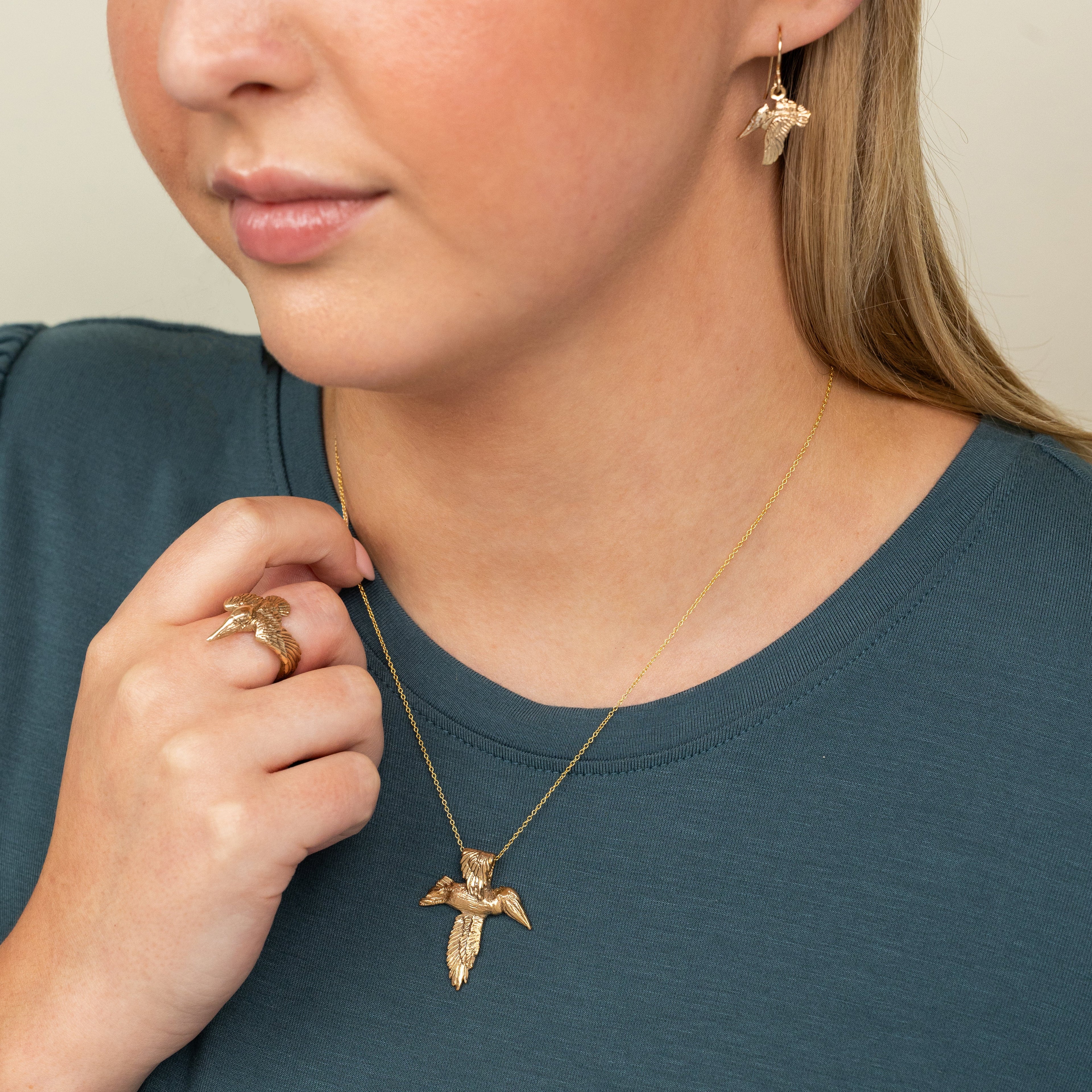 Pelican cross pendant inspired by Louisiana pelican symbolism