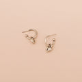 Sterling silver Love Lock heart hoop earrings with removable heart lock charms on a neutral background