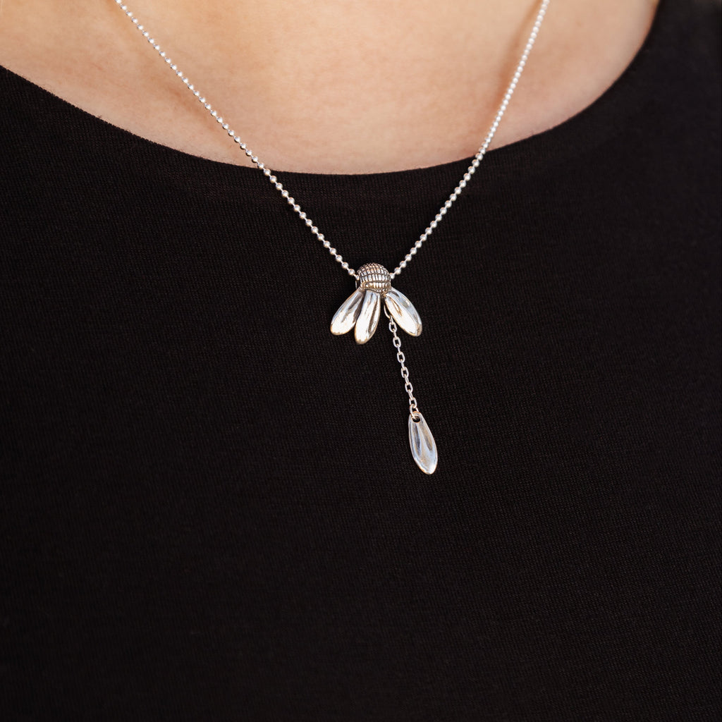 loves me daisy pendant worn on necklace