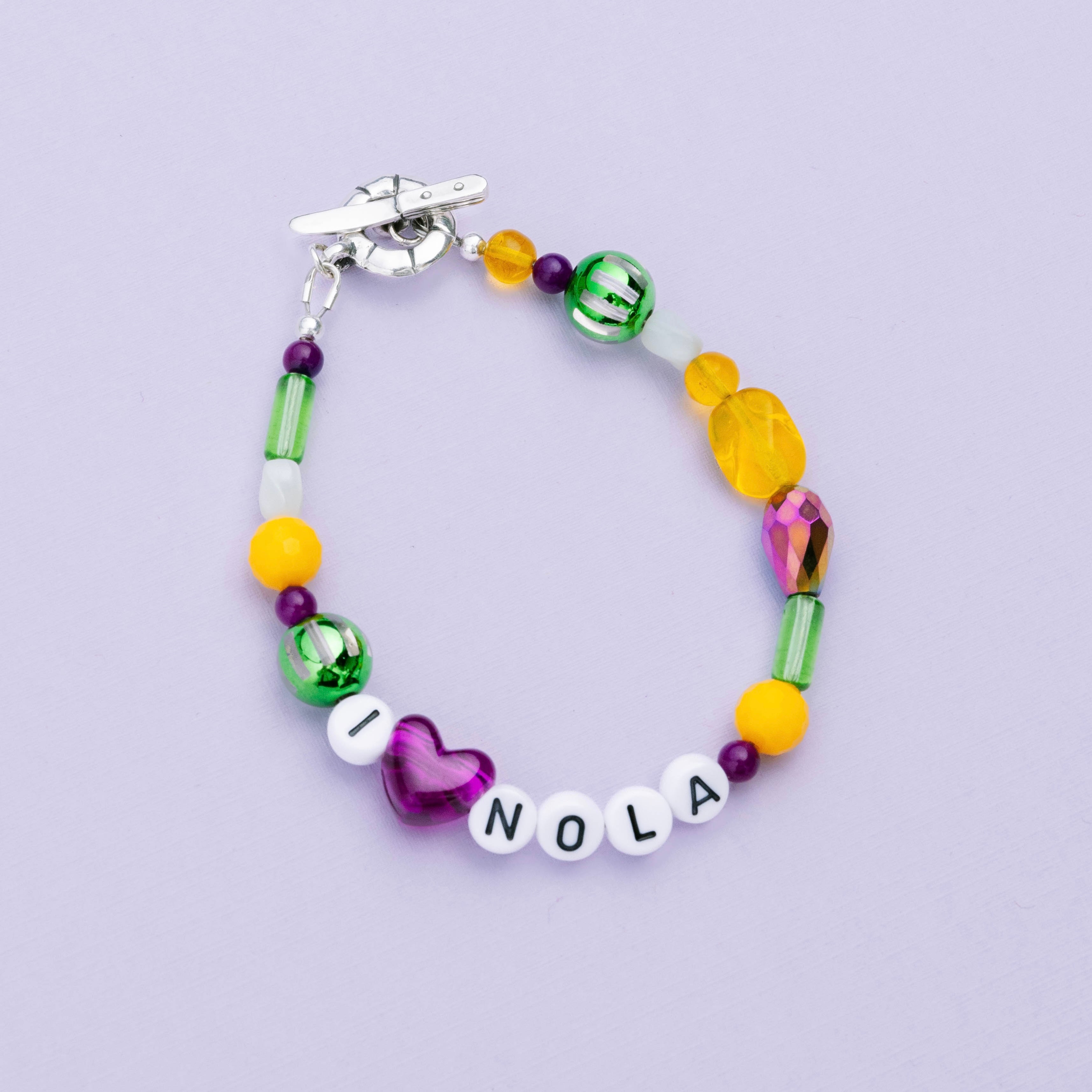 Mardi Gras Throw Bracelet with purple green and gold beads inspired by New Orleans parades