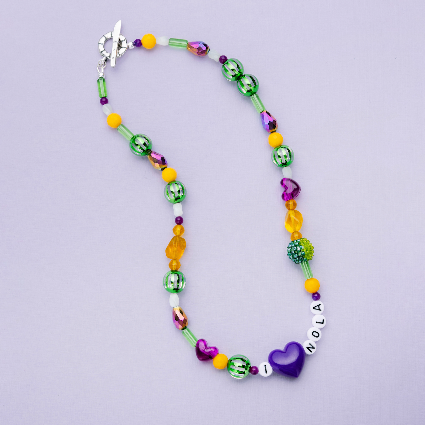Mardi Gras Throw Necklace with purple green and gold beads inspired by New Orleans parades