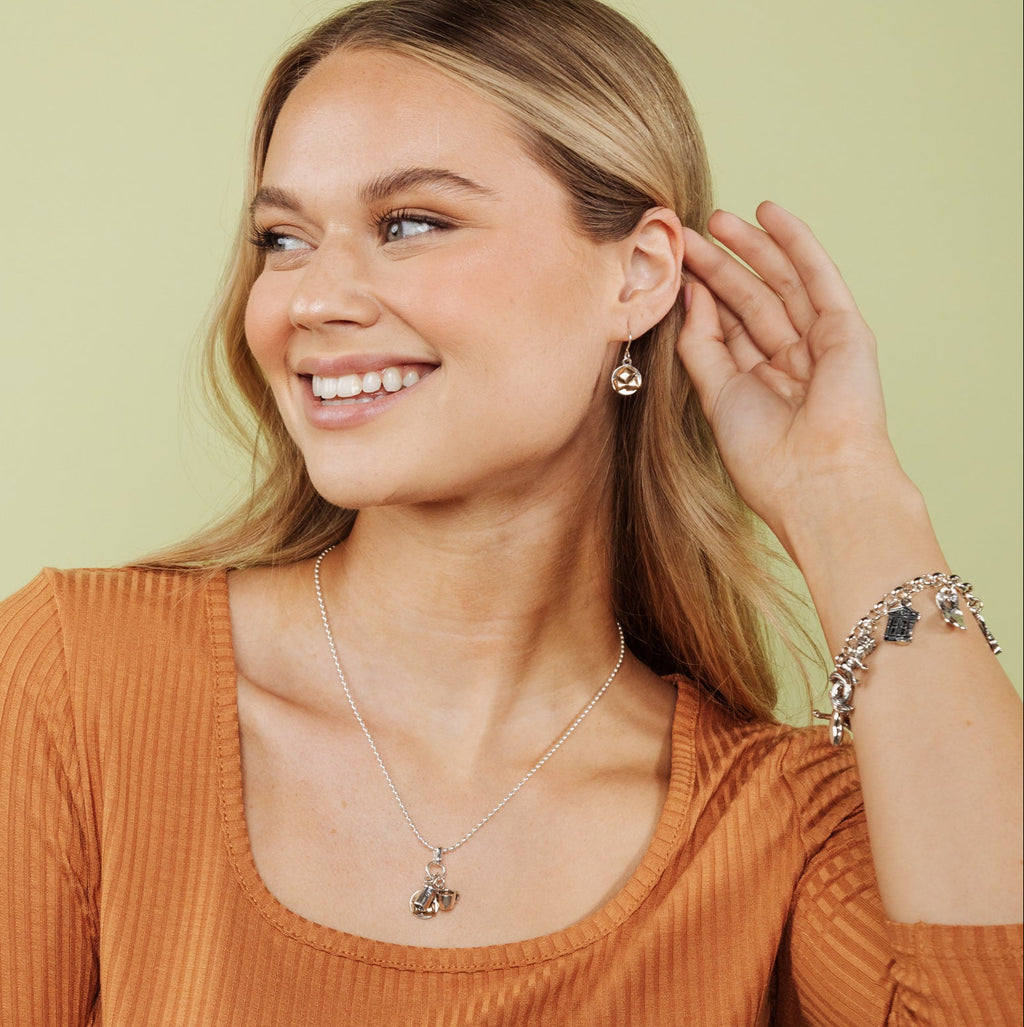 New Orleans beignet earrings worn on model inspired by French Quarter cafes