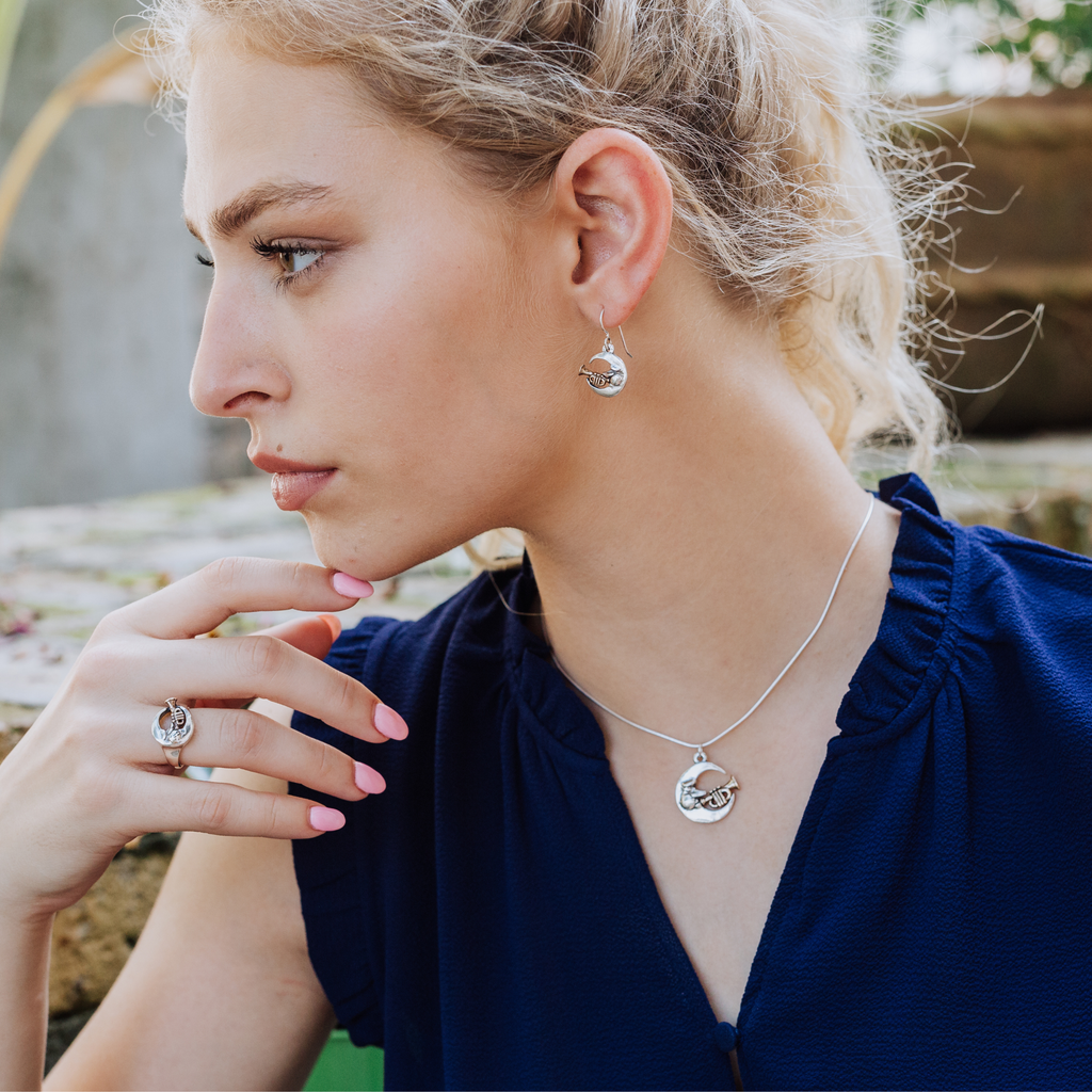 Sterling silver crescent moon pendant with jazz musician design, handcrafted in New Orleans