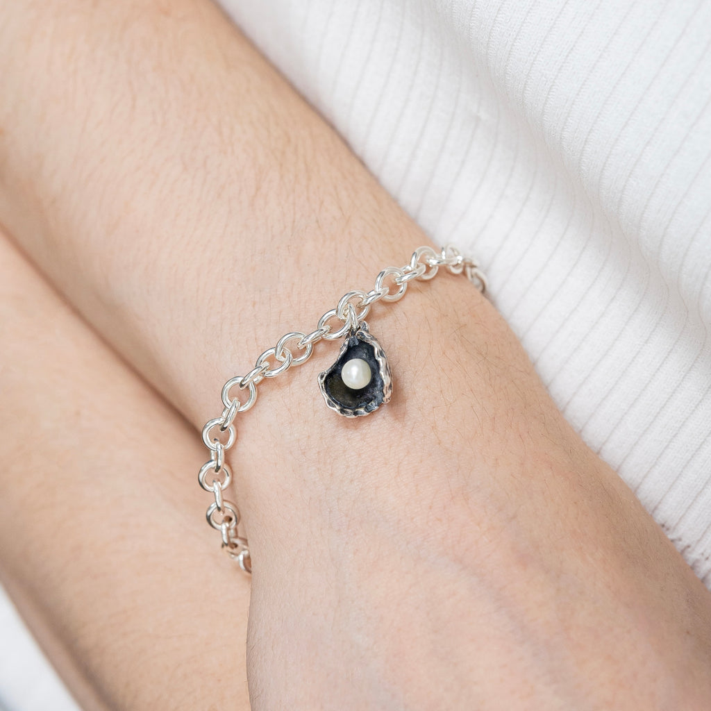 oyster pearl bracelet worn on wrist delicate sterling silver bracelet with pearl