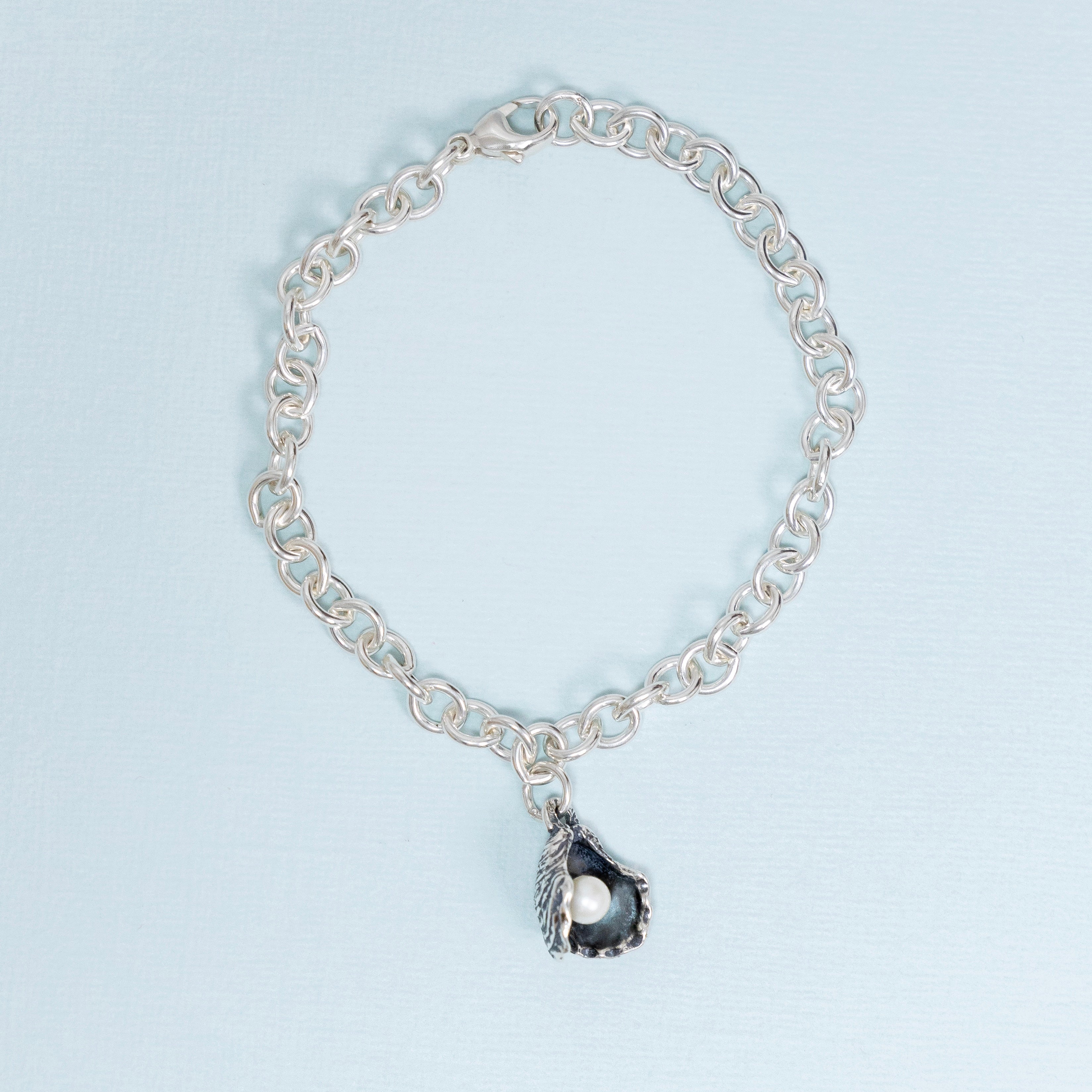 sterling silver oyster pearl bracelet with freshwater pearl charm new orleans jewelry