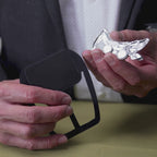 Demonstration of magnetic insert securing sterling silver alligator pocket square