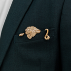 close-up of gilded lion pocket square showing sculpted detail and polished finish