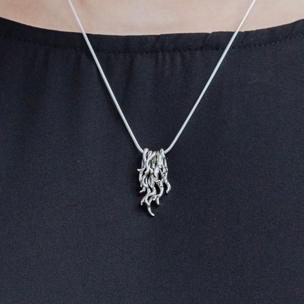 spanish moss pendant worn on necklace sterling silver