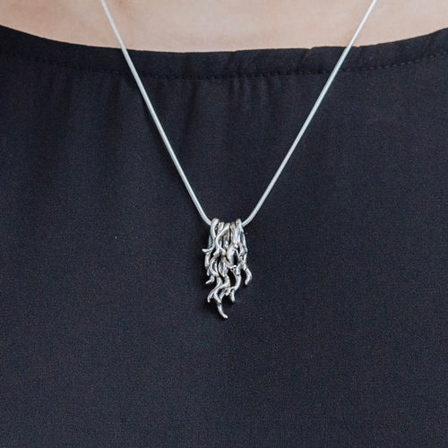 spanish moss pendant worn on necklace sterling silver