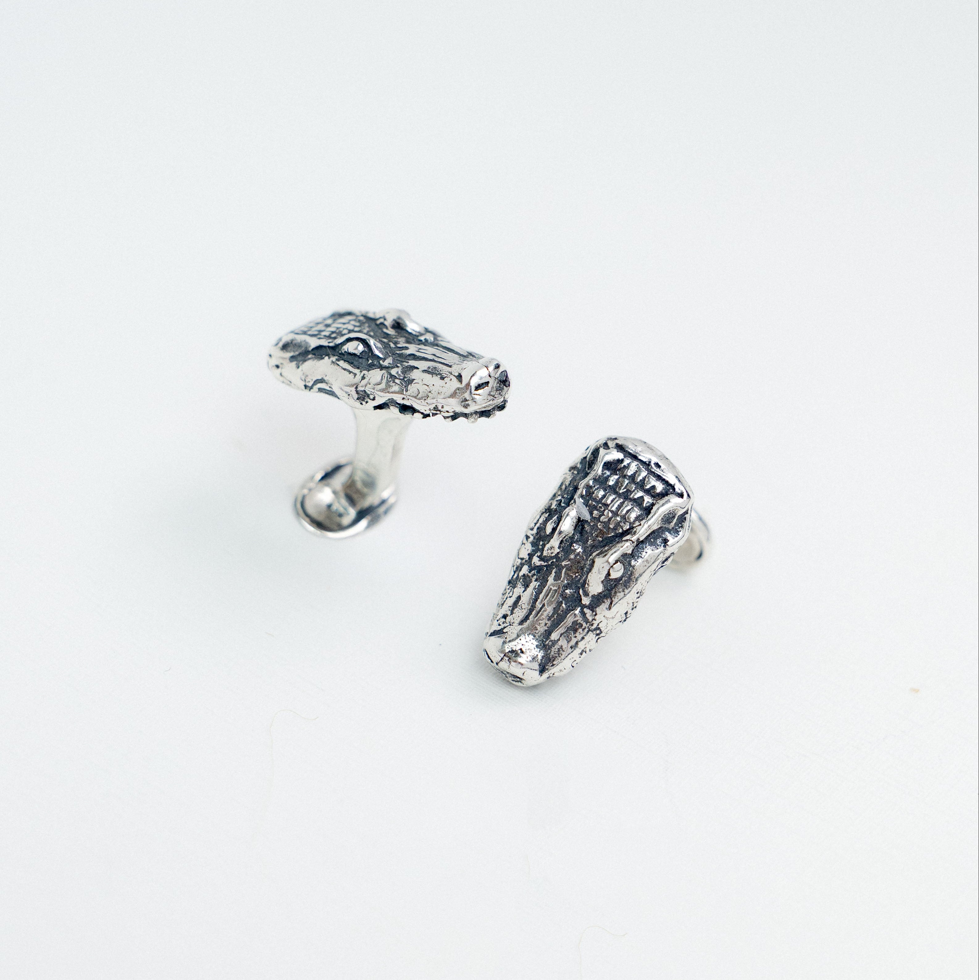 Solid sterling silver alligator cufflinks handcrafted in New Orleans.