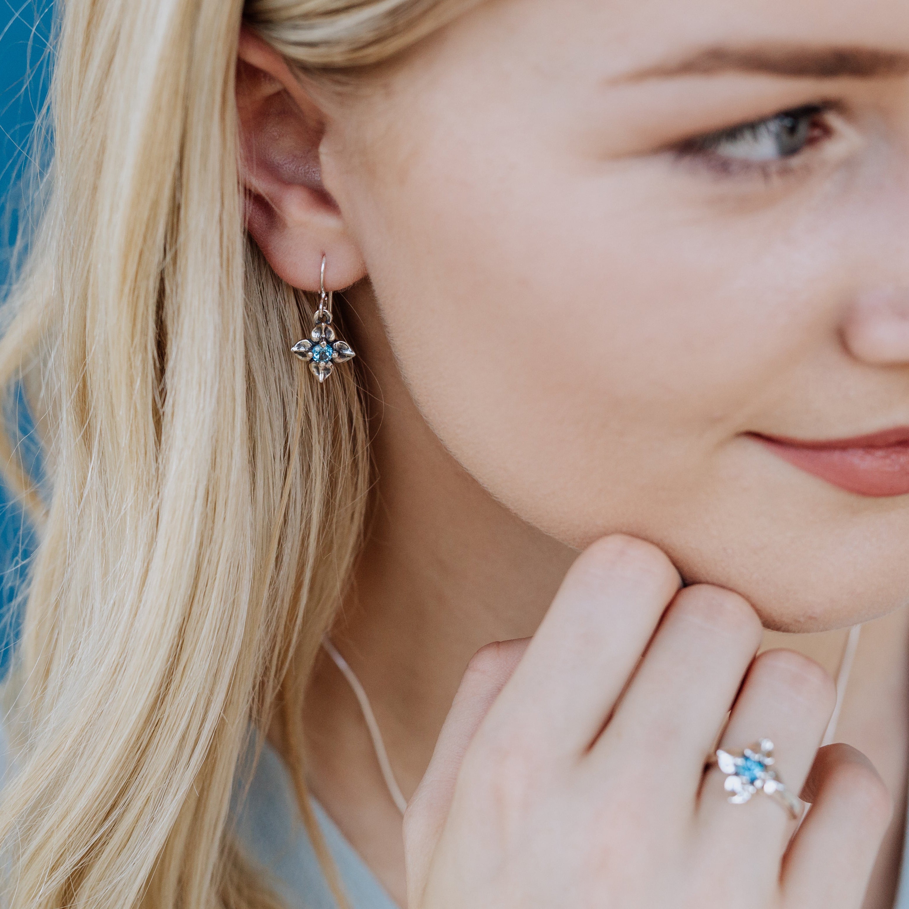 sterling silver flower earrings with blue topaz gemstones spring jewelry
