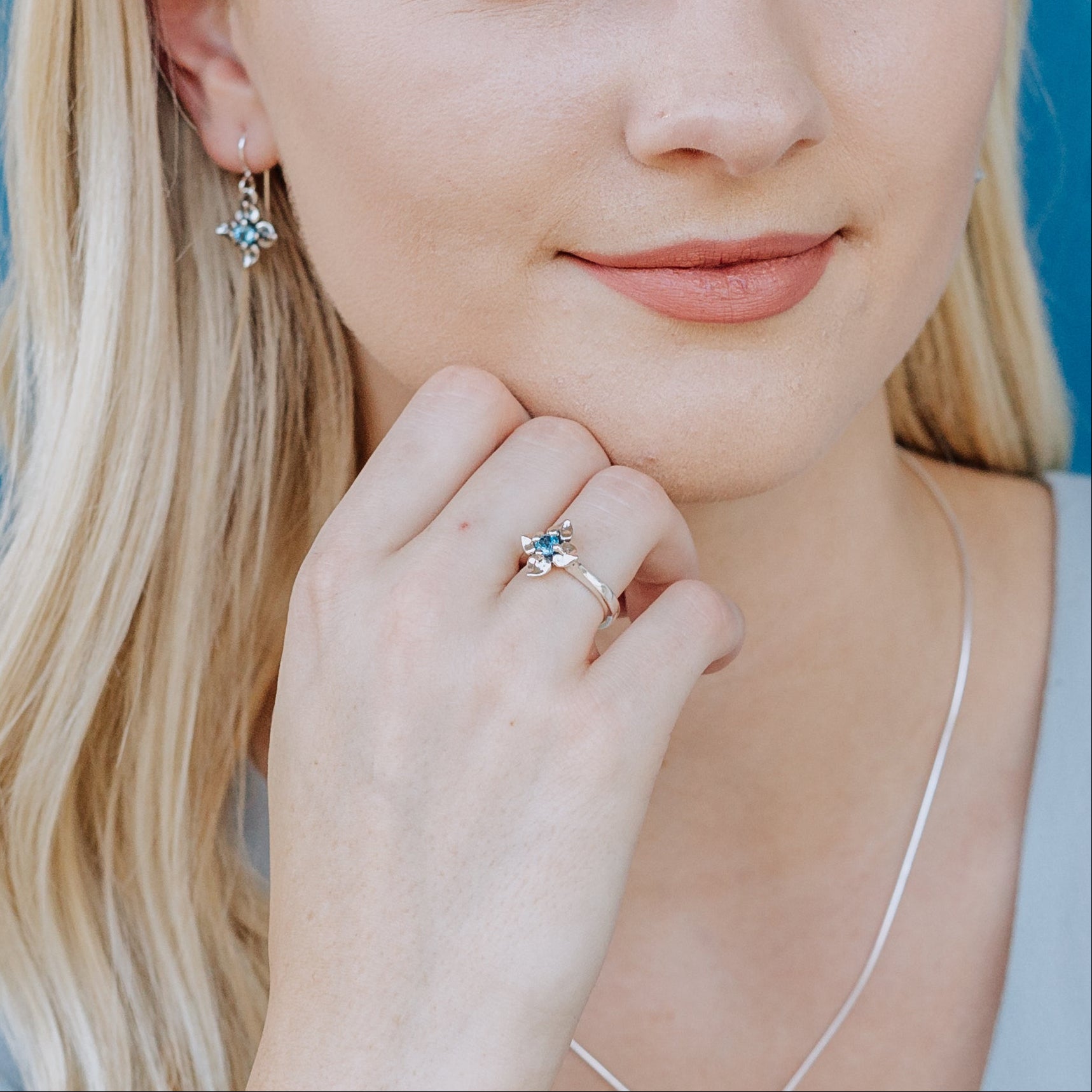 sterling silver flower ring with blue topaz gemstone spring jewelry