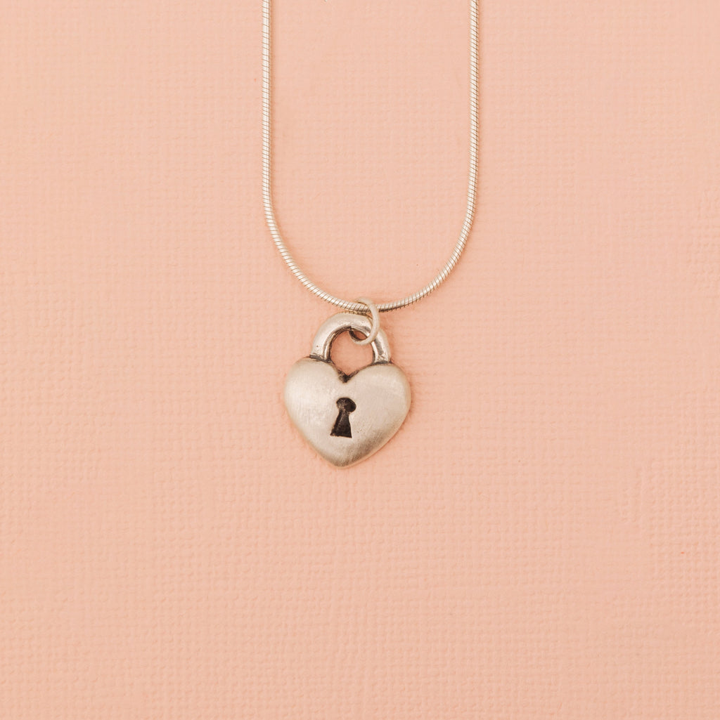 Sterling silver love lock heart pendant with keyhole detail front