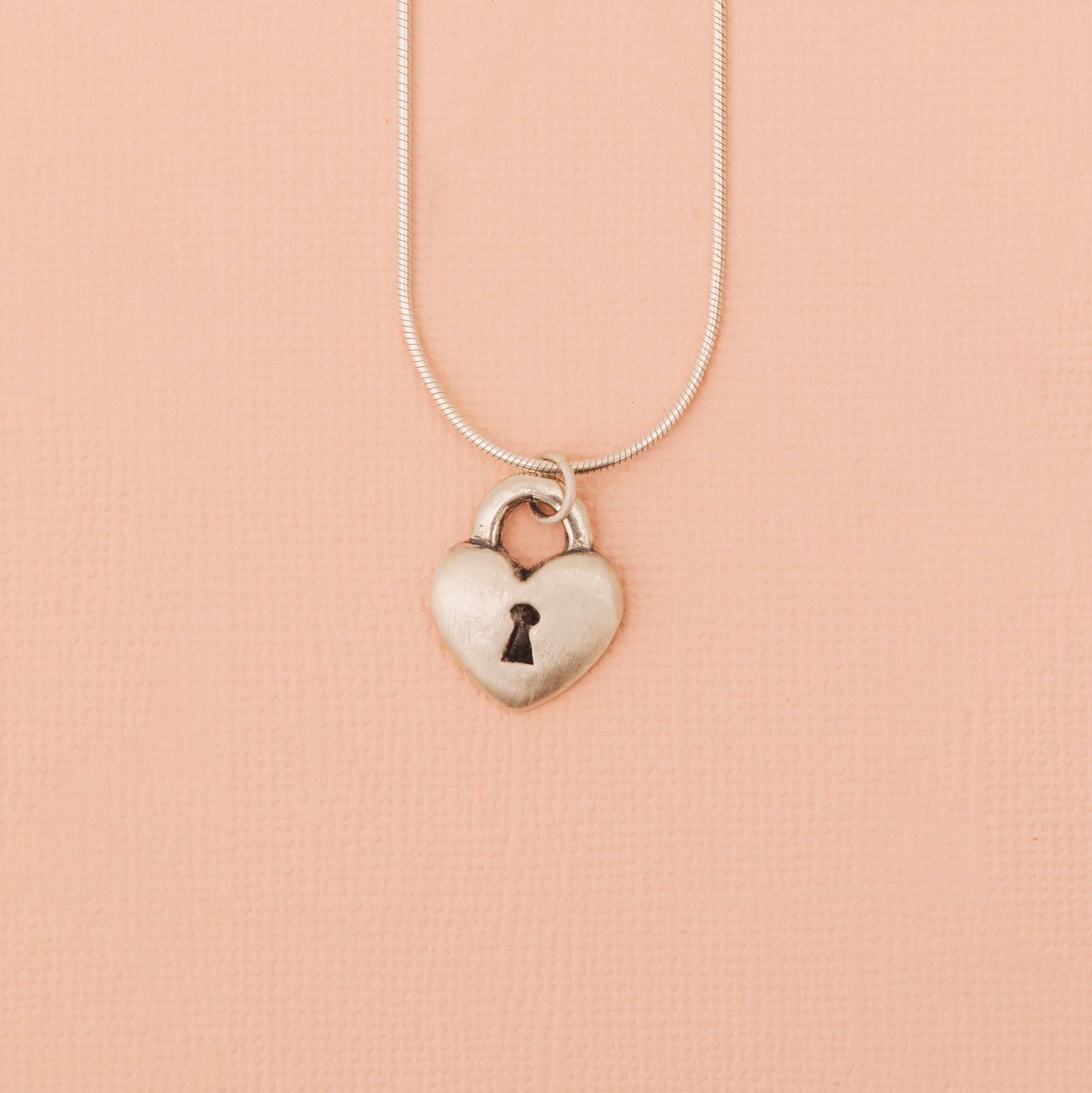 Sterling silver love lock heart pendant with keyhole detail front