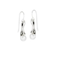 A pair of silver earrings featuring Cultured freshwater pearls, inspired by New Orleans' fleur de lis balconies.