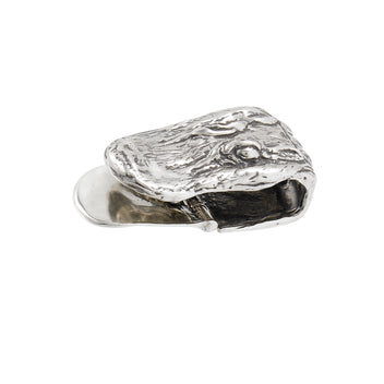 a silver object with a hole