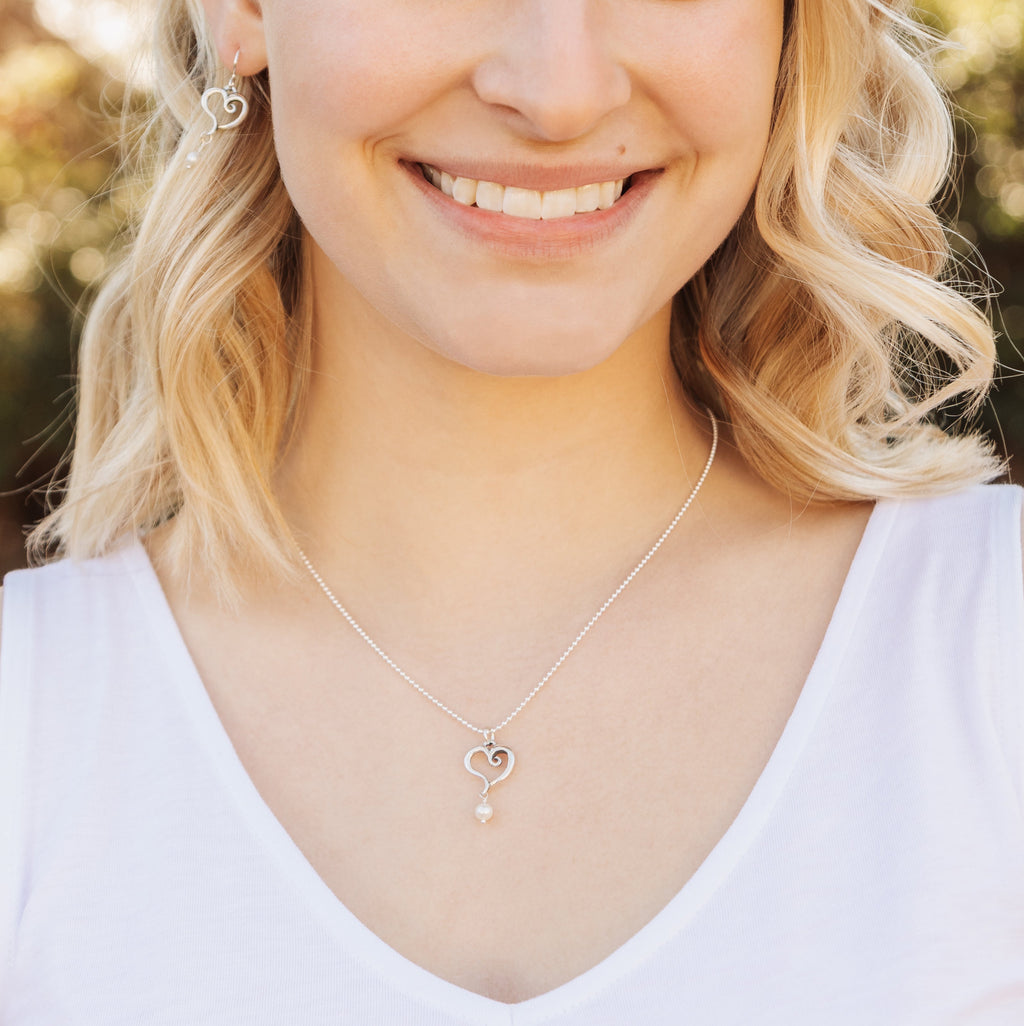 Sterling silver heart pearl pendant styled for everyday wear