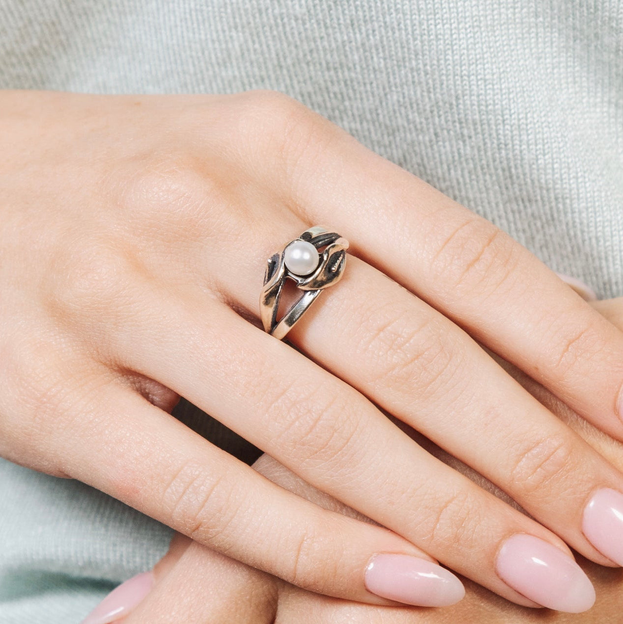 Sterling silver calla lily double pearl ring worn on hand