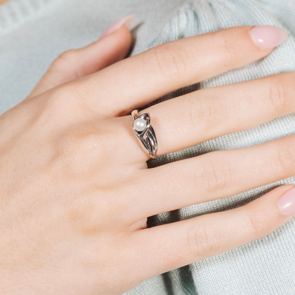 Sterling silver calla lily pearl ring worn on hand