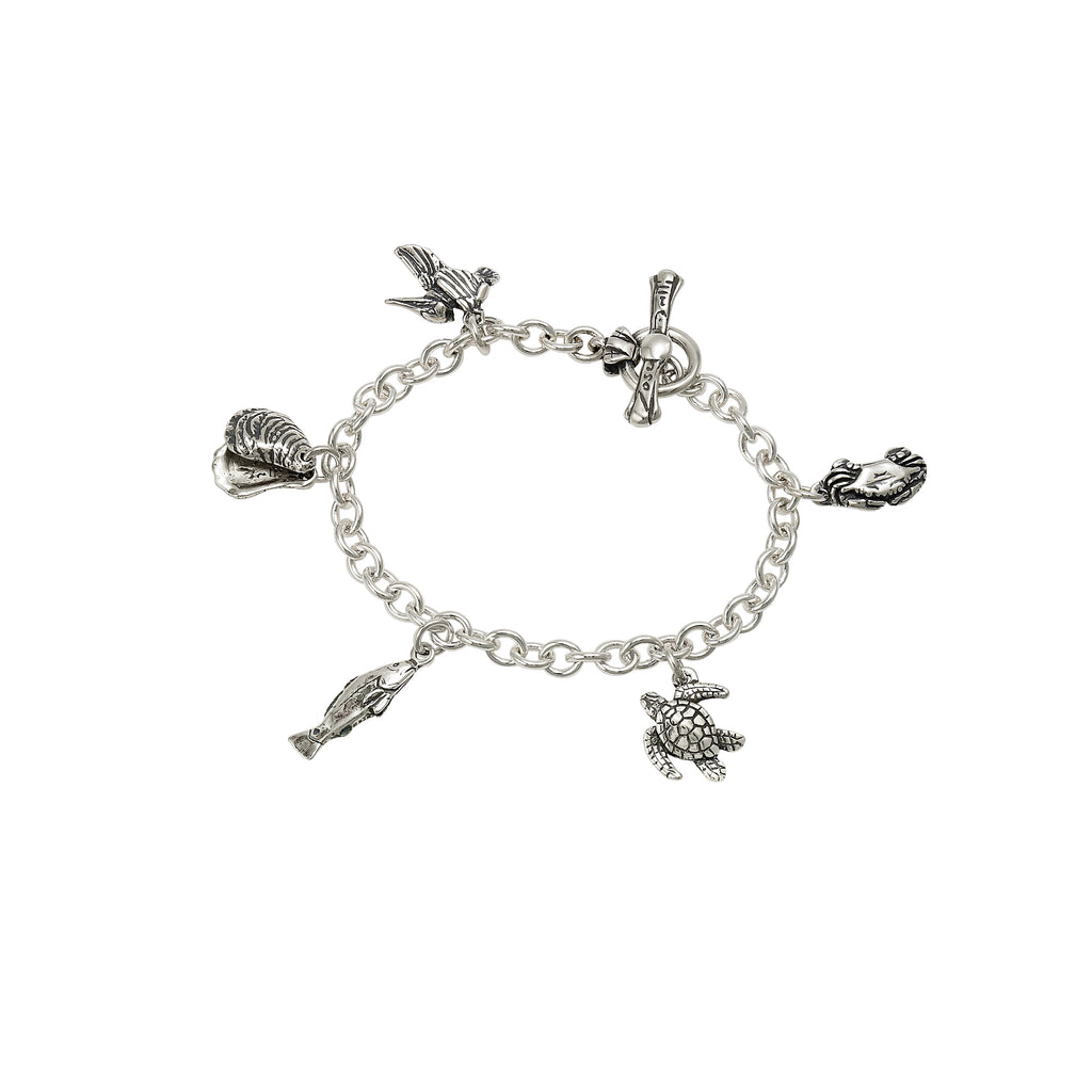 sterling silver coastal charm bracelet with pelican oyster crab turtle and fish charms, handcrafted new orleans jewelry
