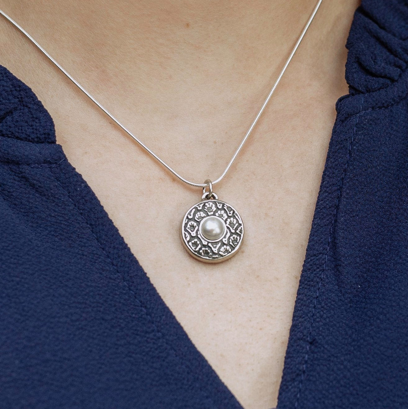 coquille oyster pearl pendant worn on necklace showing size and everyday styling
