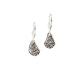 dainty oyster shell earrings in sterling silver hanging on ear wire