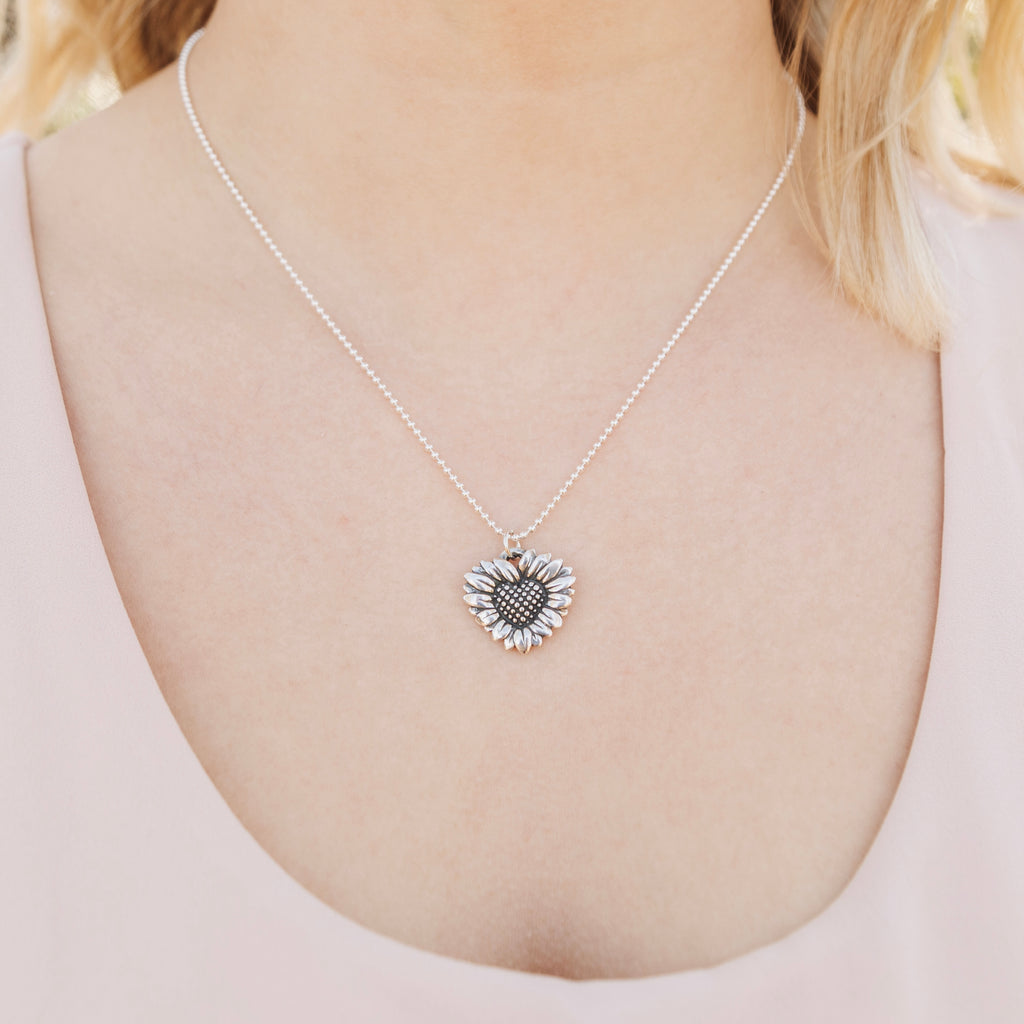 daisy heart pendant worn close on necklace