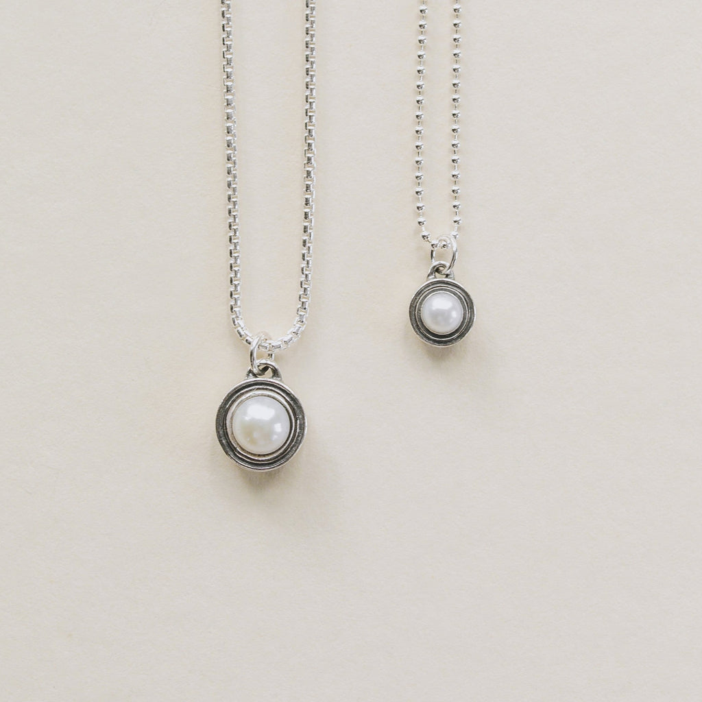 Deceaux Pearl Pendants large and small shown with sterling silver rounded box chain and beaded chain. 
