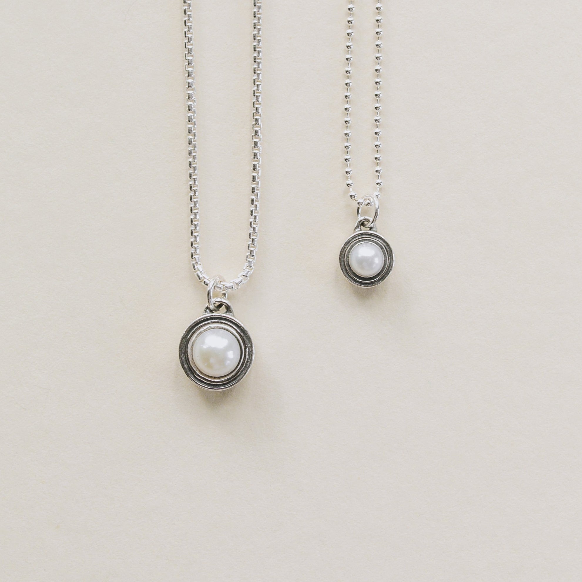 Deceaux Pearl Pendants large and small shown with sterling silver rounded box chain and beaded chain. 