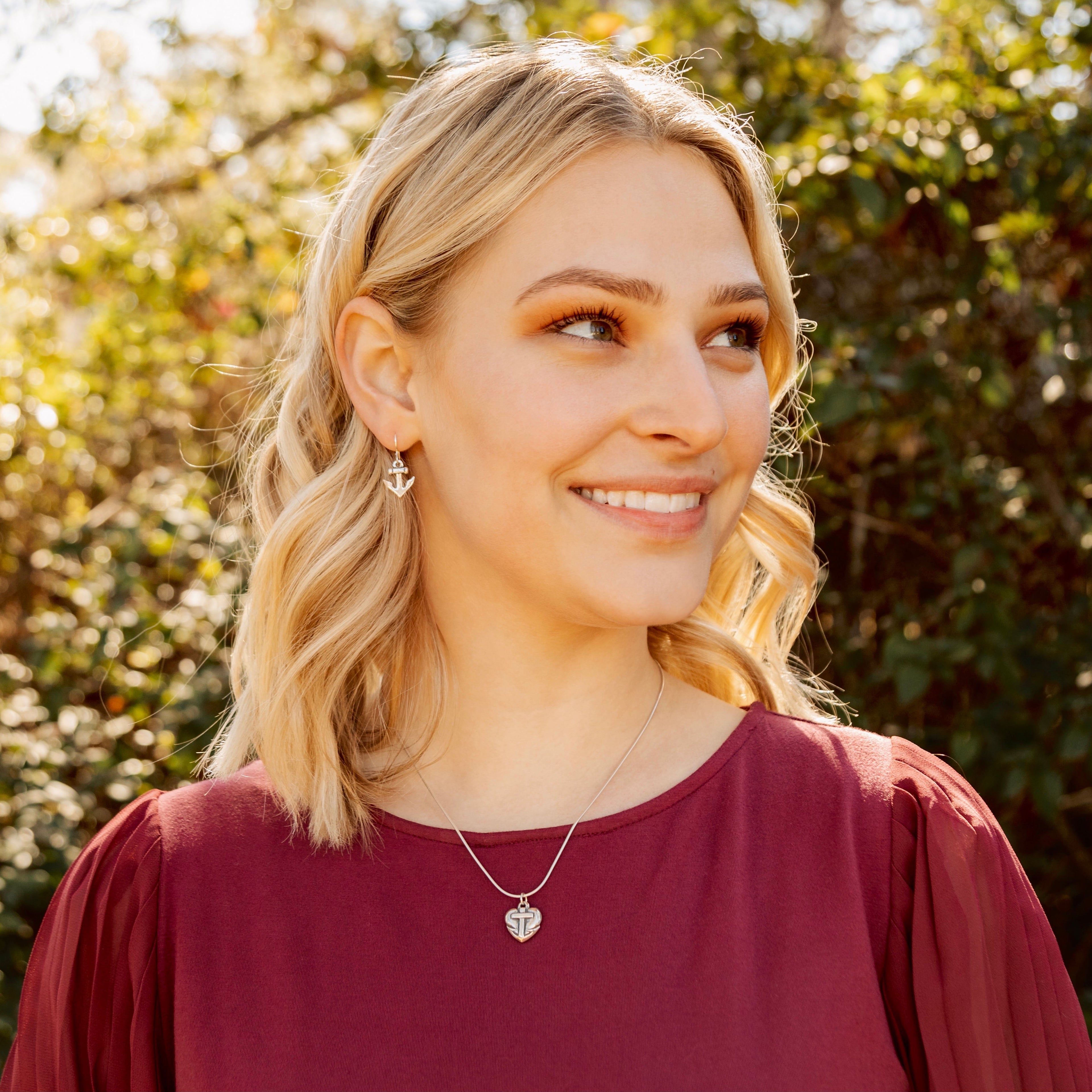 faith hope love pendant worn on model